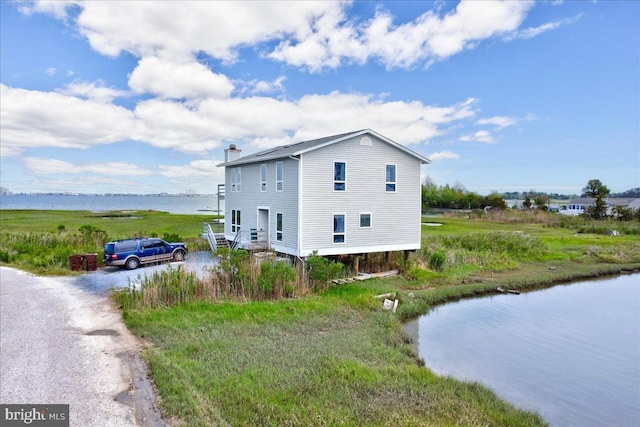 view of side of property featuring a water view