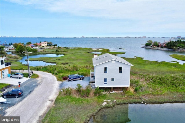 birds eye view of property featuring a water view