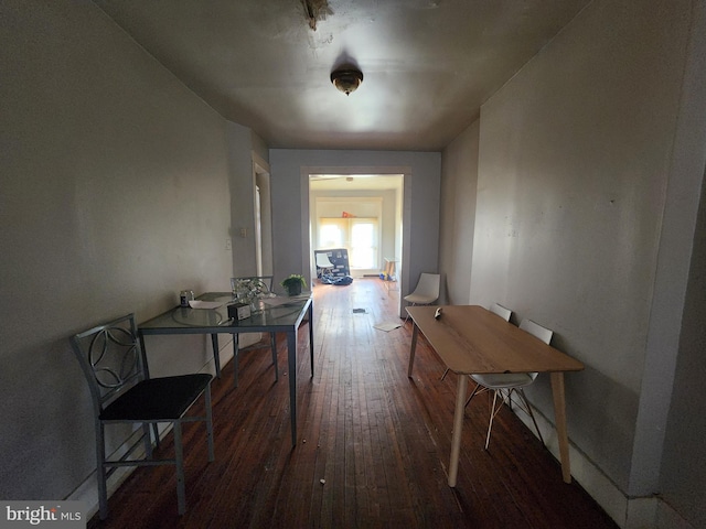 corridor with dark hardwood / wood-style floors