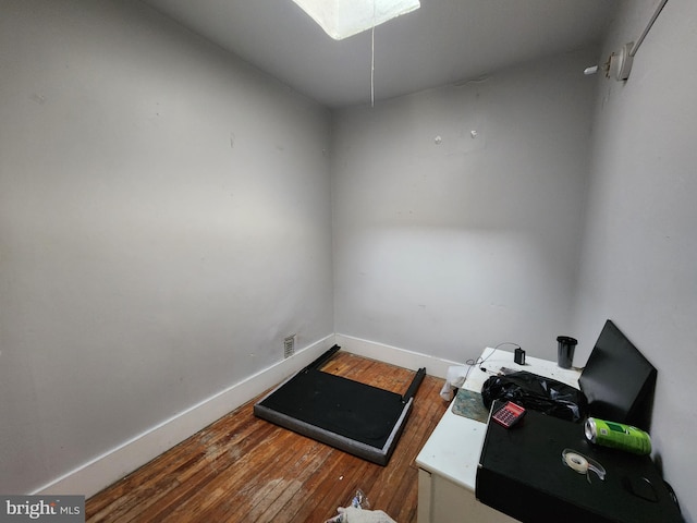 miscellaneous room with dark wood-type flooring