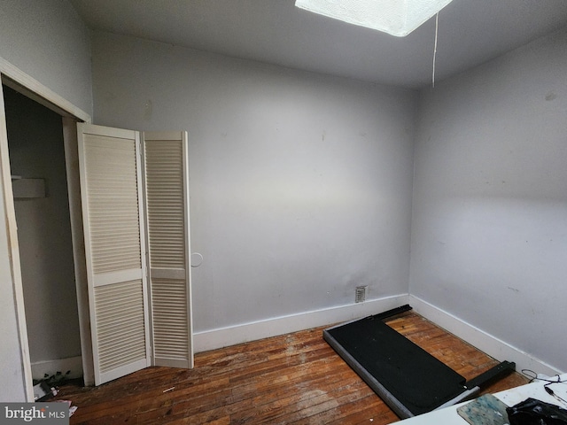 workout area featuring dark hardwood / wood-style floors