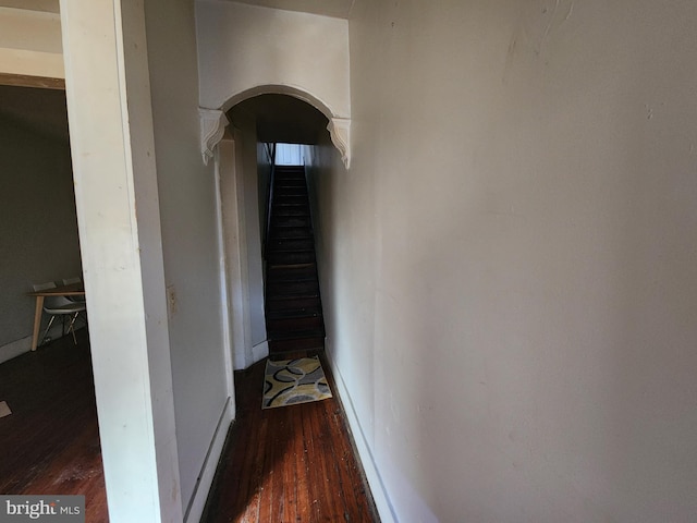 corridor featuring dark wood-type flooring