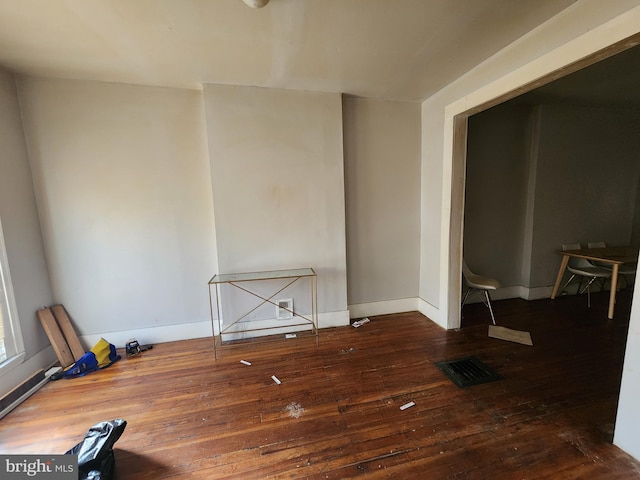 unfurnished room featuring dark hardwood / wood-style flooring