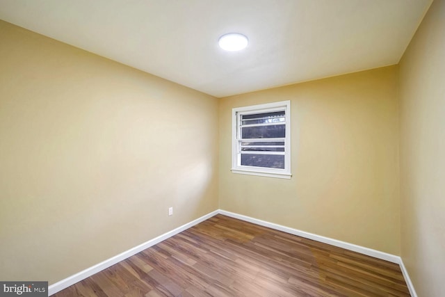 empty room featuring hardwood / wood-style flooring