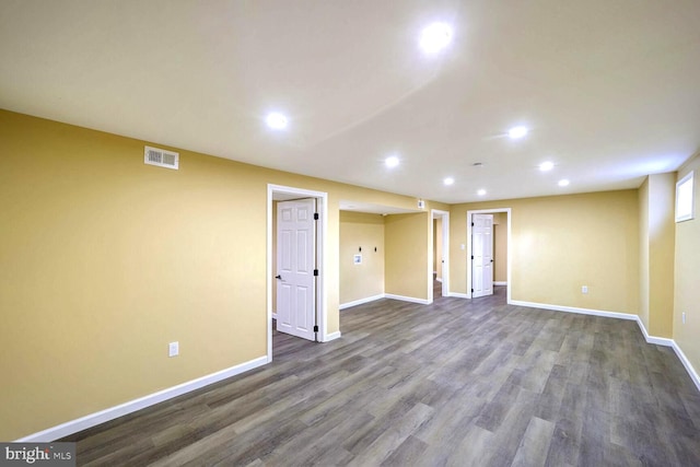 basement featuring dark hardwood / wood-style floors