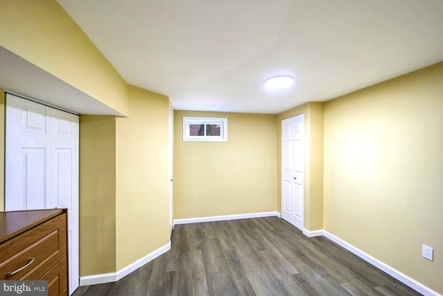 basement with hardwood / wood-style flooring