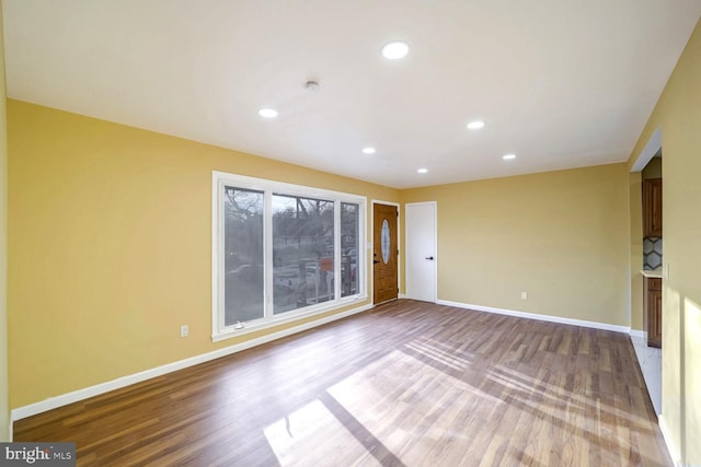 unfurnished room featuring hardwood / wood-style flooring