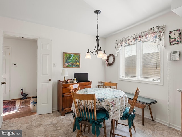 dining room with a chandelier