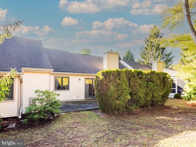 rear view of property featuring a patio area