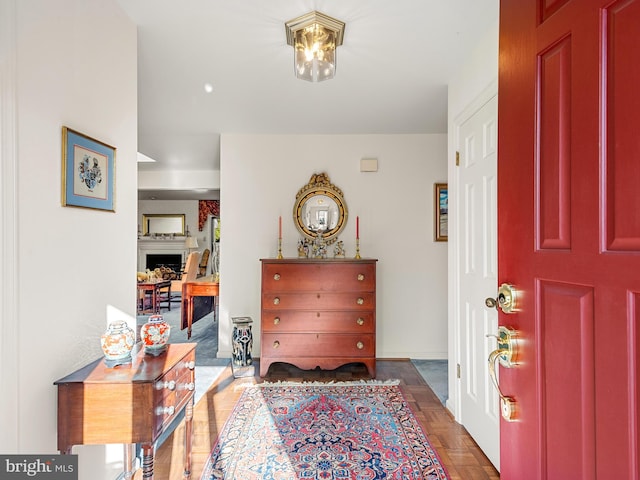 entryway featuring dark parquet floors