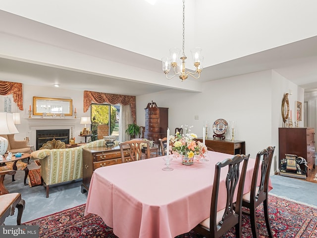 carpeted dining space with beam ceiling and a notable chandelier