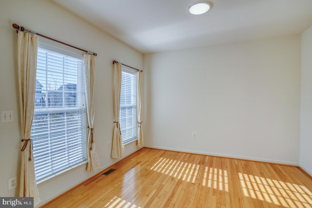 spare room featuring hardwood / wood-style flooring