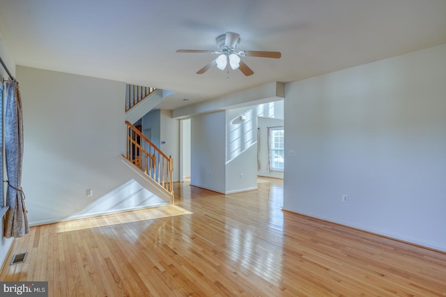 spare room featuring ceiling fan and light hardwood / wood-style floors