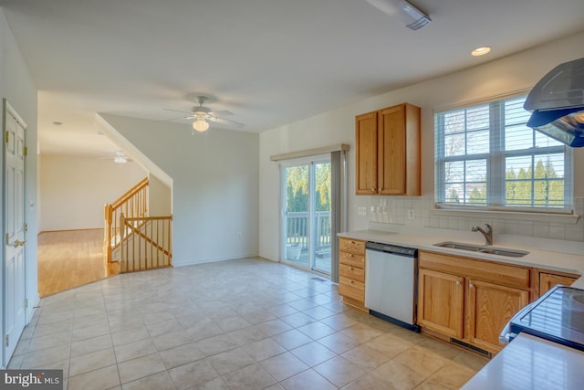 kitchen with dishwasher, plenty of natural light, decorative backsplash, and sink