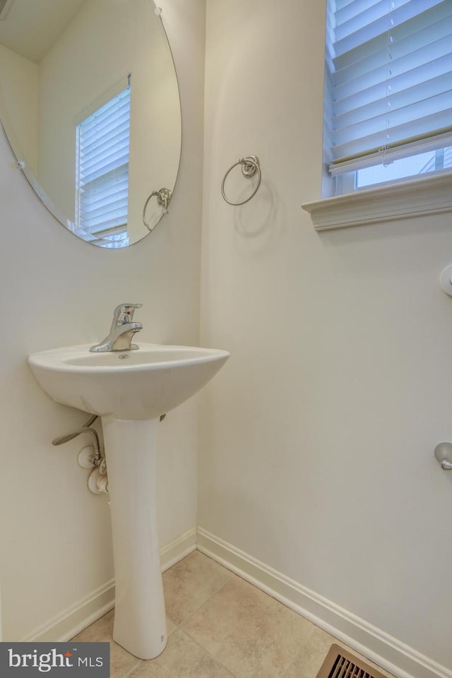 bathroom featuring tile patterned flooring and sink