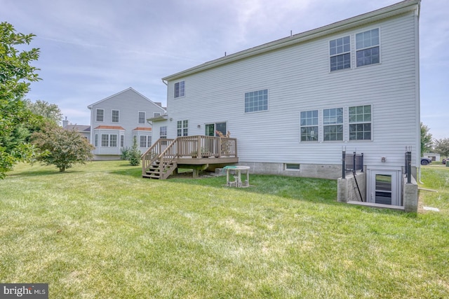 back of property with a yard, central AC unit, and a deck