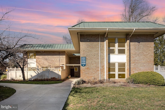 view of outdoor building at dusk