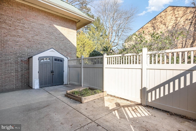 view of patio featuring a storage shed