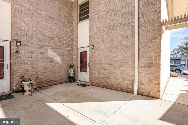 doorway to property with a patio area