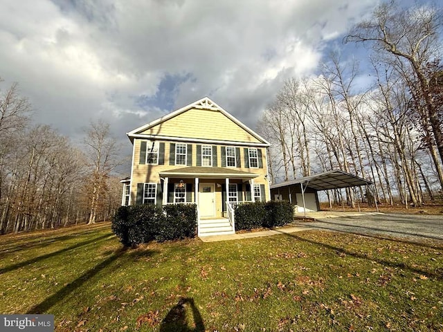 view of front of property with a front lawn, a porch, and a carport