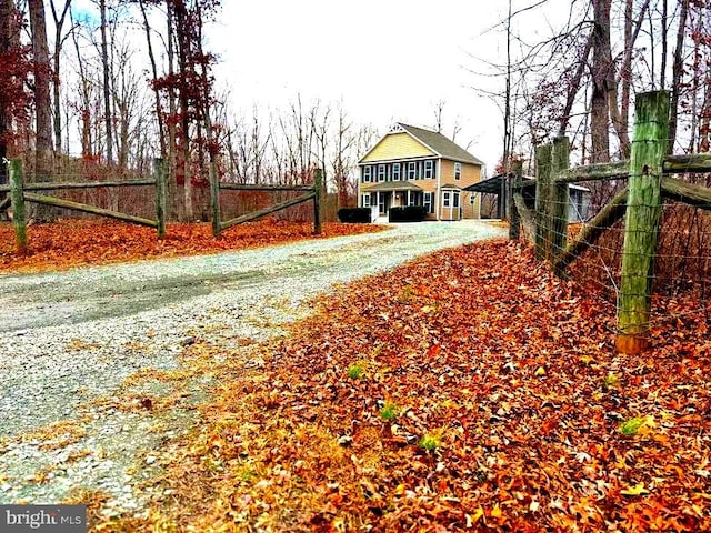 view of road featuring gravel driveway