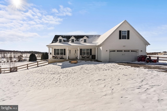 cape cod home with a porch and a garage