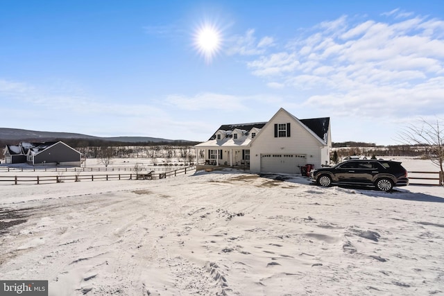 view of snowy exterior with a garage