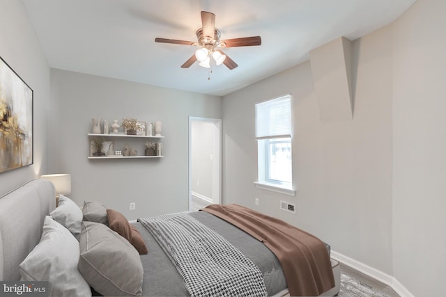 bedroom with light carpet and ceiling fan