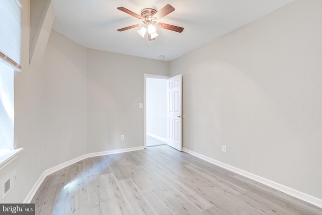 unfurnished room with ceiling fan and light hardwood / wood-style flooring