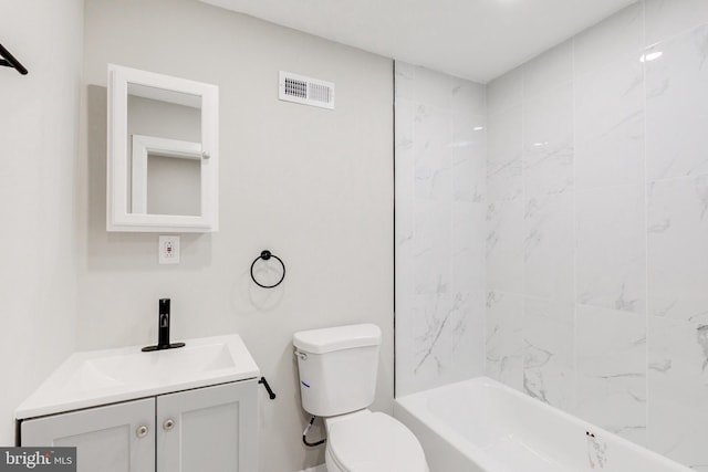 full bathroom with vanity, toilet, and tiled shower / bath