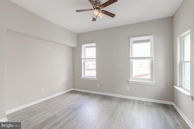 unfurnished room with light hardwood / wood-style floors and ceiling fan