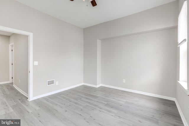 unfurnished room with ceiling fan and light hardwood / wood-style floors