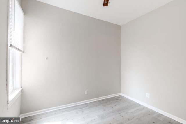 spare room featuring light hardwood / wood-style floors and ceiling fan