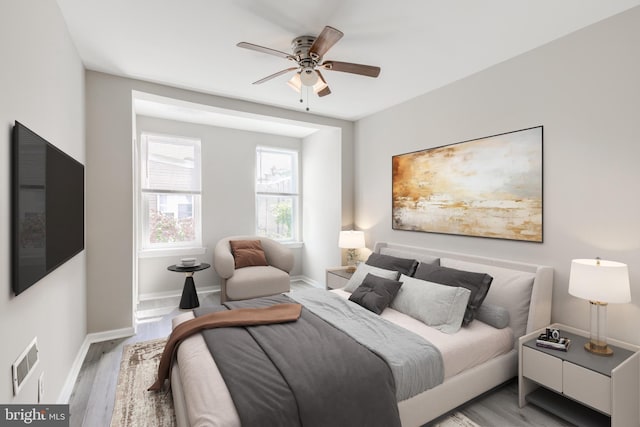 bedroom with ceiling fan and light wood-type flooring