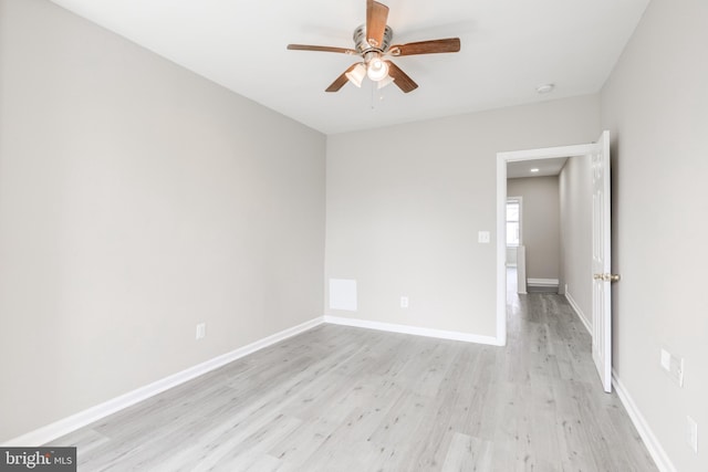 unfurnished room featuring light hardwood / wood-style flooring and ceiling fan