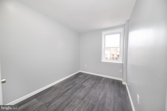 spare room featuring dark hardwood / wood-style flooring