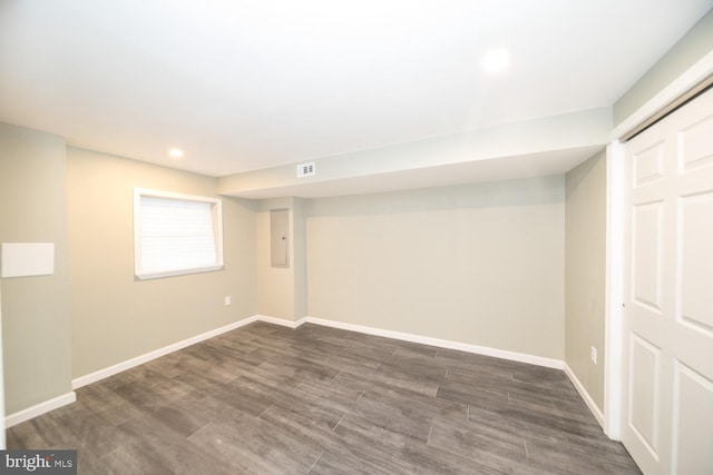 basement featuring dark hardwood / wood-style floors