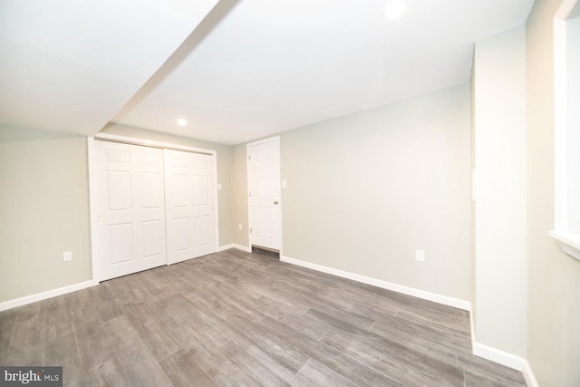 basement featuring hardwood / wood-style floors