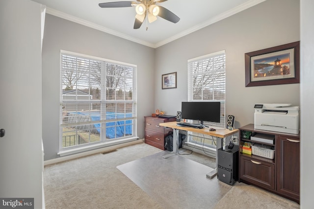 office featuring crown molding, a wealth of natural light, light colored carpet, and ceiling fan