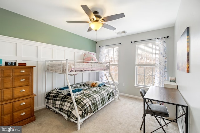 bedroom with light carpet and ceiling fan