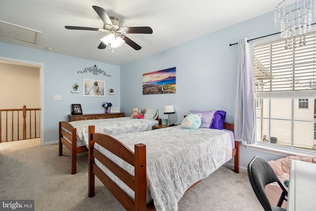 carpeted bedroom with ceiling fan and multiple windows