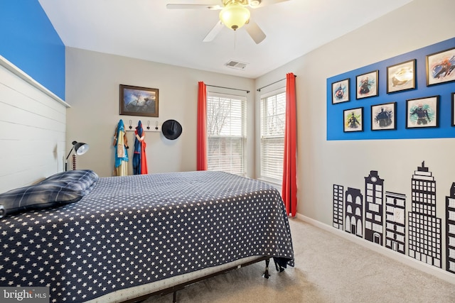 bedroom featuring light carpet and ceiling fan