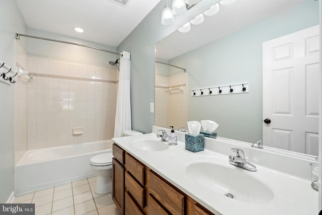 full bathroom with vanity, tile patterned floors, toilet, and shower / bath combo