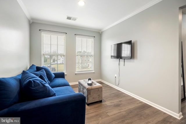 living room featuring ornamental molding and wood-type flooring