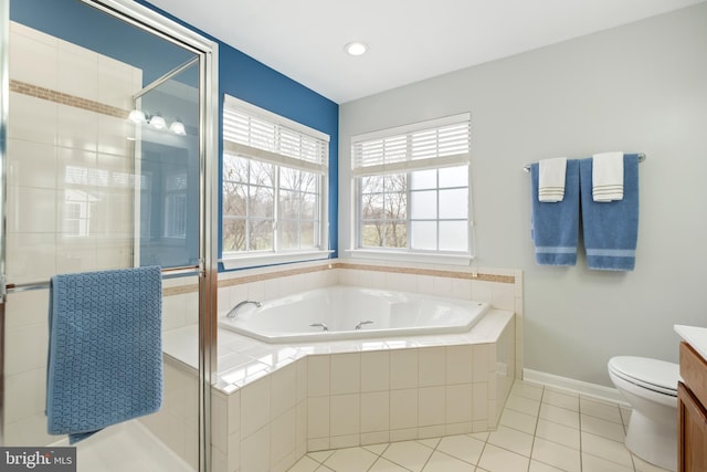 full bathroom featuring vanity, toilet, independent shower and bath, and tile patterned flooring