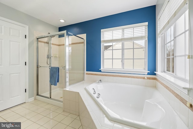 bathroom featuring plus walk in shower and tile patterned flooring