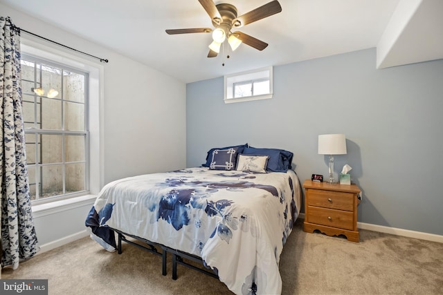 bedroom with light colored carpet and ceiling fan