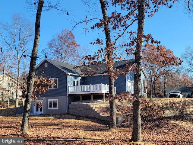 view of side of home featuring a deck