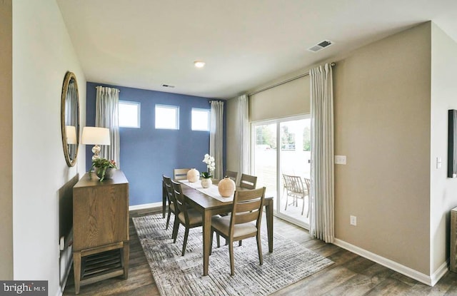 dining room with hardwood / wood-style floors