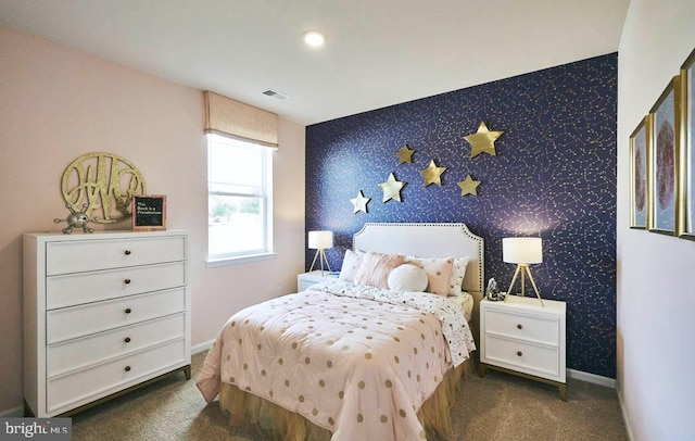 bedroom featuring dark colored carpet